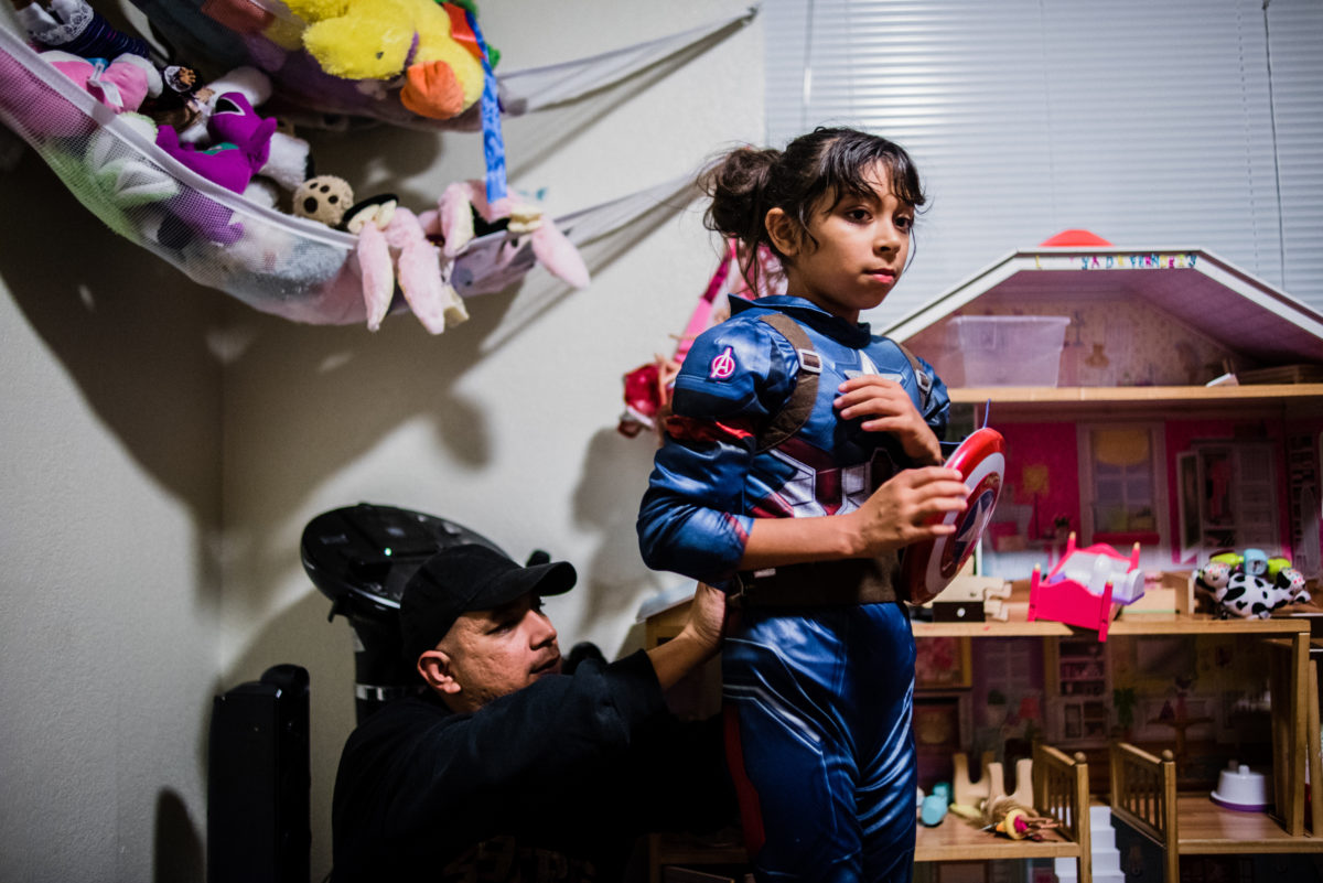 Vinson suits up Lily as Captain America while playing at home.